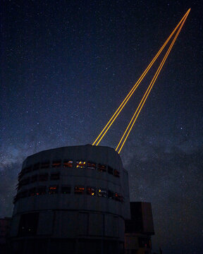 Lasers from a telescope during night at Paranal Observatory in Chile