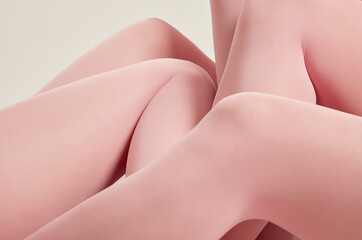 Shirtless women wearing pink stockings