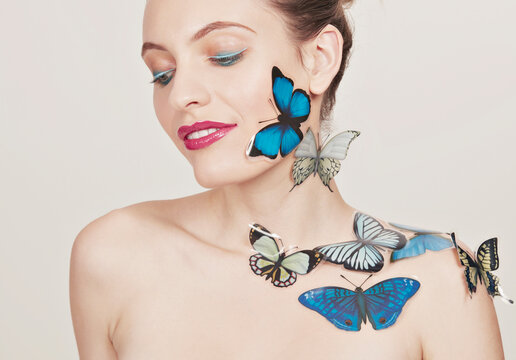 Young woman with butterfly stickers