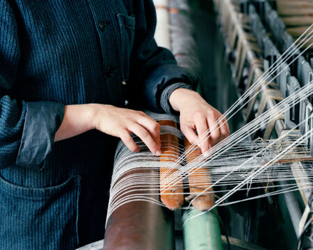 Woman using loom