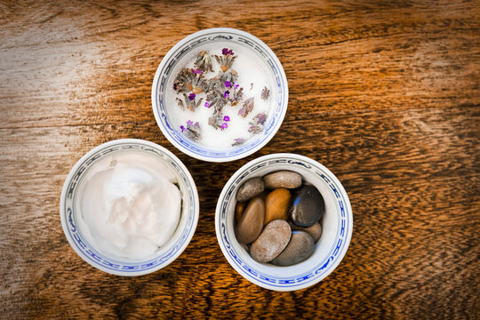 Bowls of stones, paste and flowers