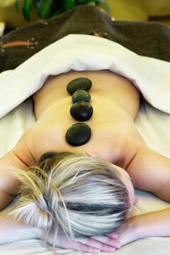 Young woman receiving lastone therapy