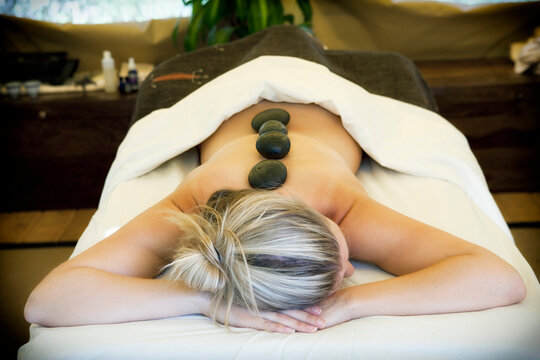 Young woman receiving lastone therapy