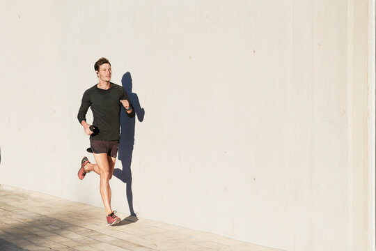 Man wearing sportswear jogging