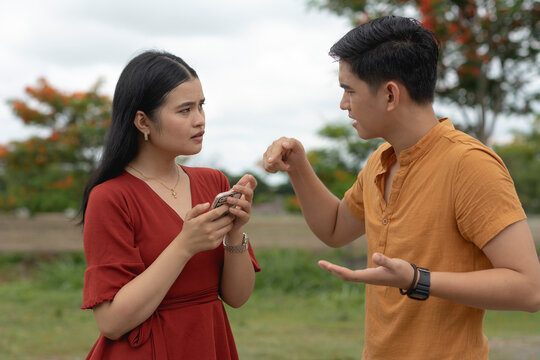 A jealous and suspicious boyfriend demands to know why he can't look at his girlfriend's cellphone. A man having hunch and feeling fishy about his partner's actions.