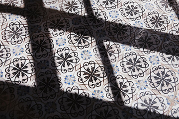 Shadow on tiled floor