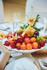 Naklejka na ściany i meble Fruits with a beautiful presentation on the festive table.