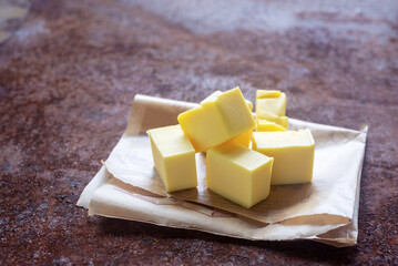 cold cubes butter on brown paper