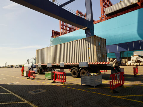 Truck with cargo container at Port of Felixstowe, England