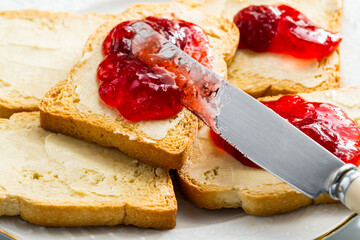 Spreading jam on bread