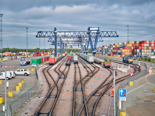 Dockyard railway tracks and cargo cranes, Felixstowe, England.
