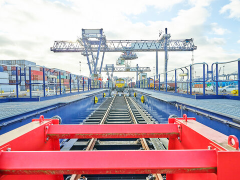 Red buffer stop in railway dockyard, Felixstowe, England.