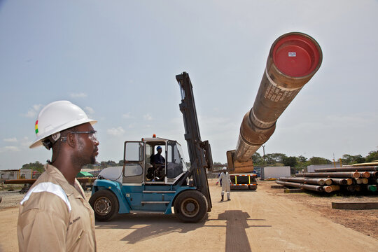 Forklift moving large pipe