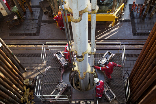 View from above of workers at oil rig