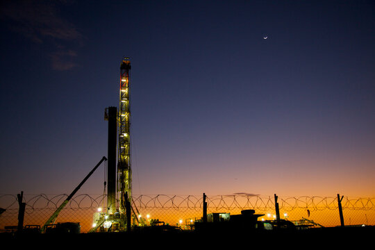 View of drilling rig at sunset