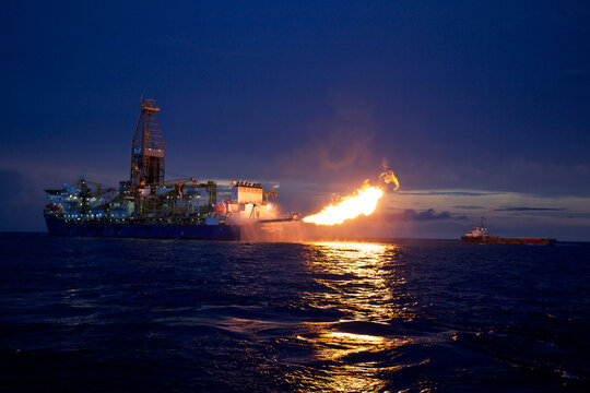 Oil rig in sea at night