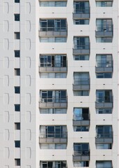 Building exterior with symmetrical windows and balconies 