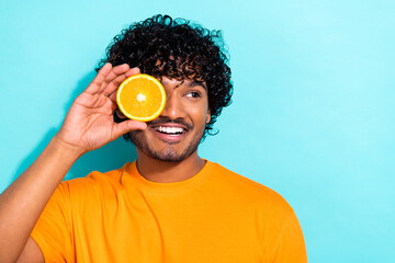 Closeup photo of young funky man cover his eye citrus lemon fresh taste juice looking empty space...