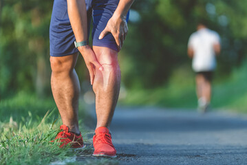 male athlete up close, Knee soreness following activity.It frequently occurs during athletic...