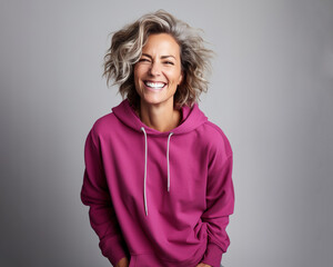 Fototapeta premium Smiling Gray-Haired Woman in Magenta Sweatshirt