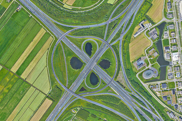 Raod, highway, flyover road junction - spaghetti and roundabout looking down aerial view from above, bird’s eye view expressway and intersection landscape, Utrecht, Netherlands