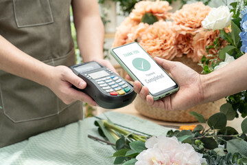 Customer using phone for payment at cafe restaurant,cashless technology and money transfer...