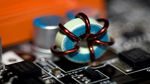 Close up of inductor copper coil on circuit board