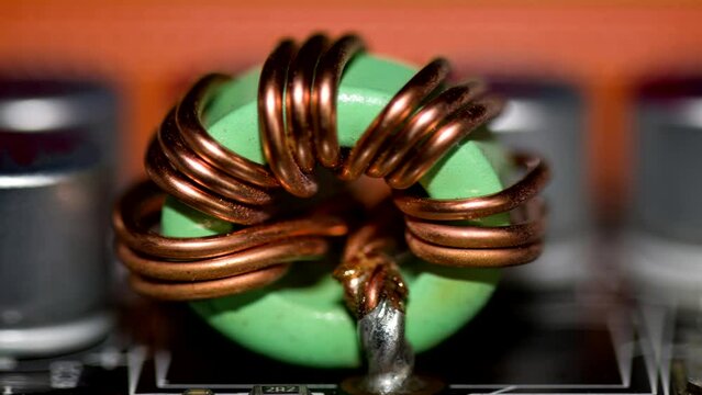 Close up of inductor copper coil on circuit board