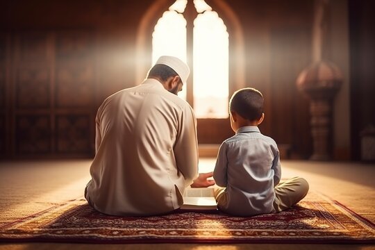 father and his son pray the koran in a mosque