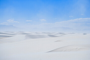 Fototapeta na wymiar sand dunes in the desert under a blue sky