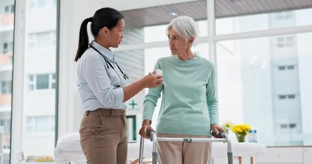 Medication, walker or doctor talking to old woman in retirement or hospital for wellness or support. Pills, caregiver or nurse with medicine advice for elderly patient with walking frame in clinic