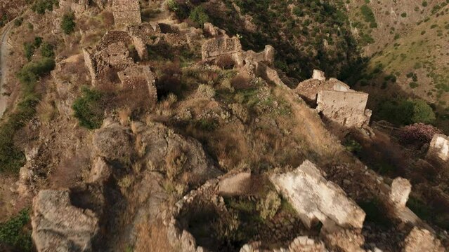 Ancient ruins of a medieval castle on top of the mountain. Amendolea Castle. 