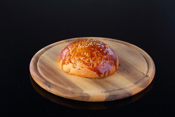 burger bun on wooden background
