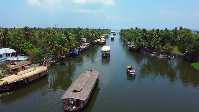 Aerial view of traditional houseboat cruising Kerala backwaters. Travel India