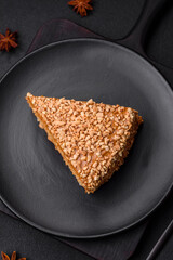 Delicious sweet puff waffle cake with cream and nuts cut into pieces