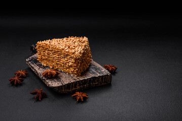 Delicious sweet puff waffle cake with cream and nuts cut into pieces