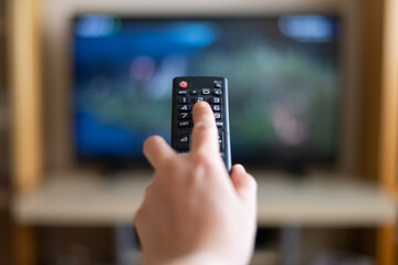 Remote Control In Hand. Video On Demand Television Internet Stream Multimedia Concept