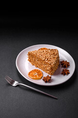 Delicious sweet puff waffle cake with cream and nuts cut into pieces