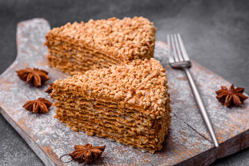 Delicious sweet puff waffle cake with cream and nuts cut into pieces
