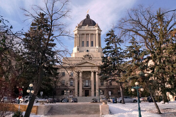 Winter view of Manitoba Legislative building in Winnipeg city, the capital of the province of Manitoba, Canada. This 77 metres tall neoclassical Beaux-Arts style building designed and built by Frank