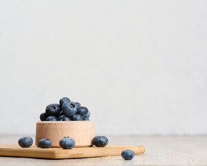 Ripe blueberries in a bowl on the table, healthy and tasty berry