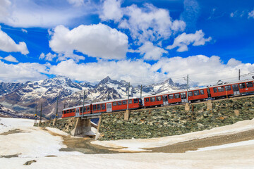 Beautiful view of the Swiss Alps with cogwheel train of Gornergrat railway close to Zermatt, Switzerland