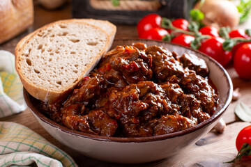 Beef goulash, soup and a stew, made of beef chuck steak plenty of paprika. Hungarian traditional meal.