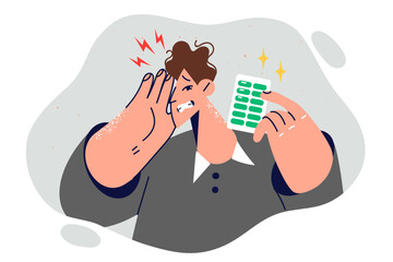 Man feels headache and shows blister pack of medicine to treat migraine or get rid of dizziness