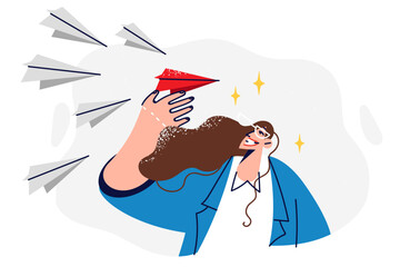 Business woman holds flying airplane symbolizing team leadership and ability to manage employees