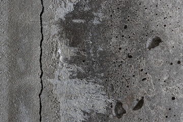 Texture of old cracked concrete wall. Rough gray concrete surface. The gap between the reinforced concrete slabs. Perfect for background and design. Close-up. High resolution.