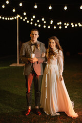 Obraz premium transfer of wedding fire with the help of candles the newlyweds
