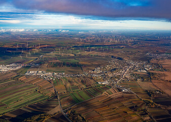 Aerial view of the many wind turbines that generate electricity in the vicinity of the Austrian capital - 633148509