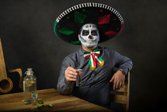 Catrin Wearing Mariachi Hat And Raising A Toast In A Bar. Day Of The Dead Celebration.