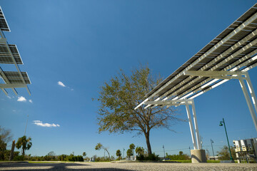 Destroyed by hurricane wind photovoltaic solar panels mounted on carport roof for producing green...